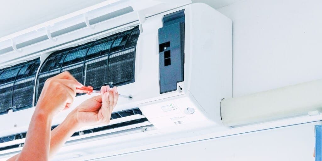 Technician installing a ductless mini-split AC system in New Jersey