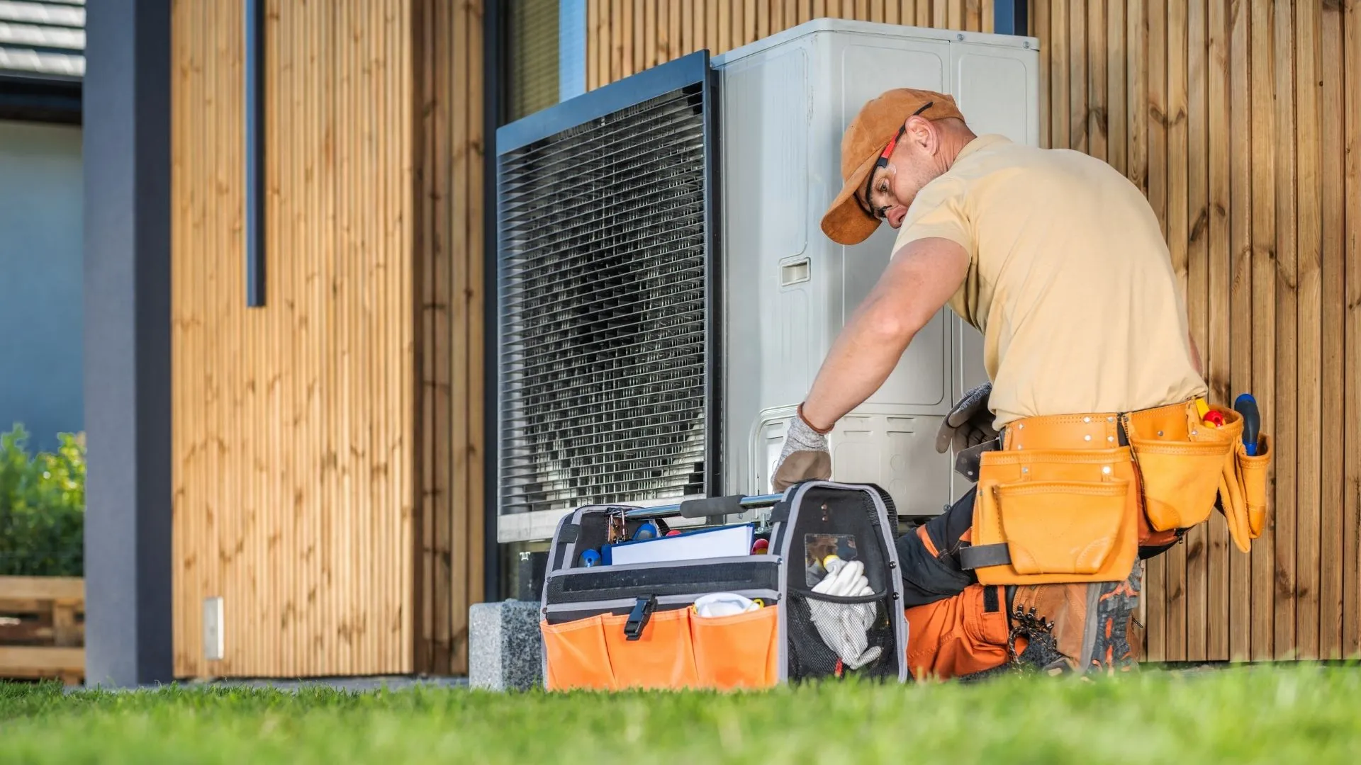 HVAC technician repairing an AC system in New Jersey